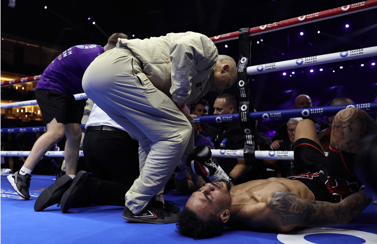 Ben Whittaker lies on the canvas after flipping over the ropes with Liam Cameron