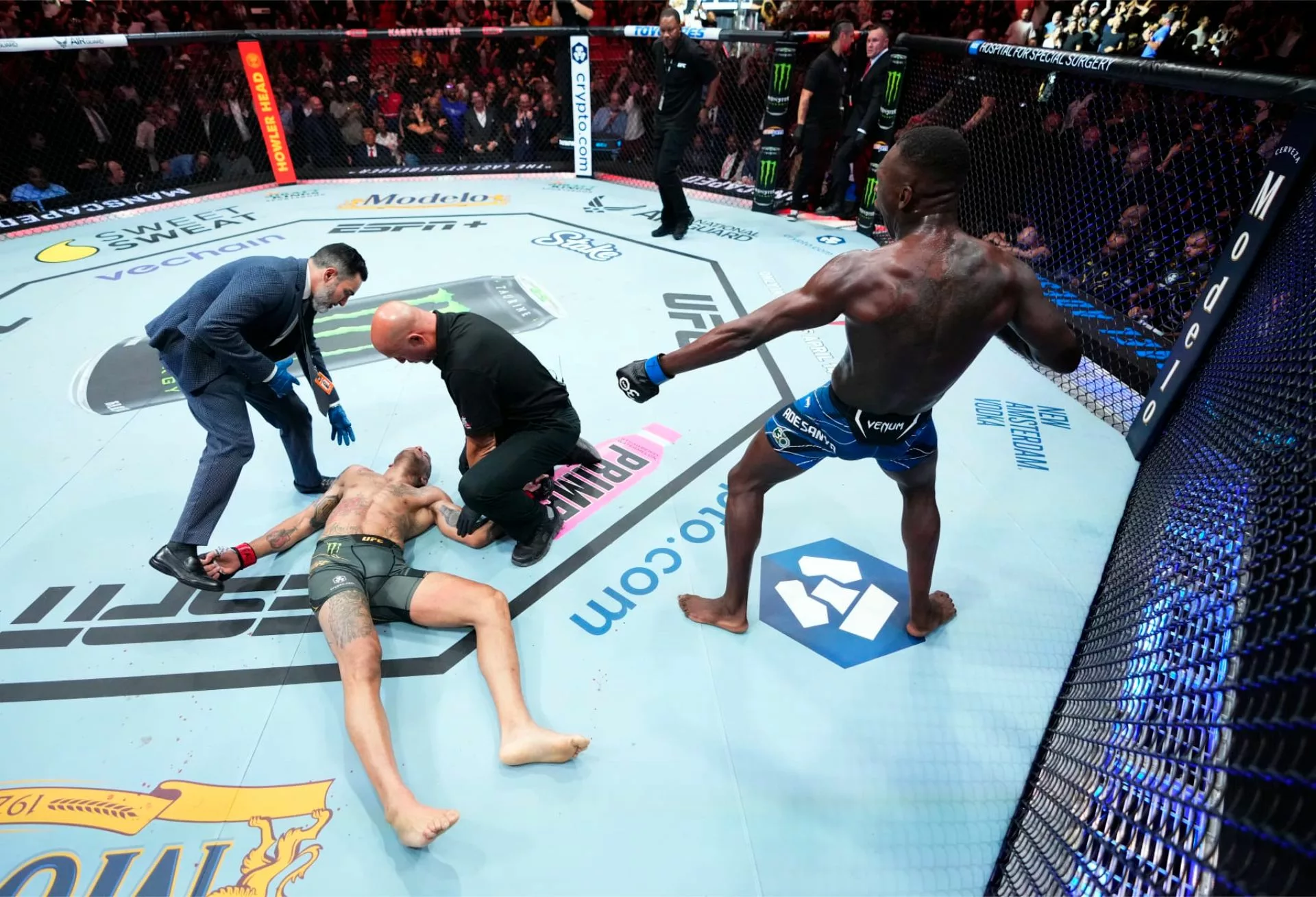 Image of Israel Adesanya celebrating knockout over Alex Pereira